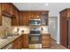 Well-equipped kitchen featuring stainless steel appliances, granite countertops, and plenty of cabinet storage at 410 Sheringham Ct, Roswell, GA 30076