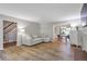 Spacious living room featuring a couch, hardwood floors and a fireplace at 410 Sheringham Ct, Roswell, GA 30076