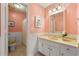 Bathroom with vanity, framed mirror, decorative lights, tiled floor and shower-tub combo at 440 Junction Trak, Roswell, GA 30075
