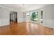 Bright dining room with hardwood floors, a bay window, and a stylish chandelier at 440 Junction Trak, Roswell, GA 30075