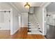 Elegant foyer with hardwood floors, staircase, and access to multiple rooms, showcasing an open layout at 440 Junction Trak, Roswell, GA 30075