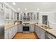 Well-equipped kitchen featuring stainless steel appliances and granite countertops at 440 Junction Trak, Roswell, GA 30075