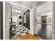 Functional laundry room featuring a stacked washer and dryer and checkerboard floors at 440 Junction Trak, Roswell, GA 30075
