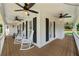 Spacious porch featuring rocking chairs and ceiling fans for relaxing outdoor living at 440 Junction Trak, Roswell, GA 30075