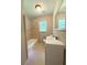Neutral bathroom featuring a shower and tub combination, modern sink, and window at 882 Campbell Rd, Covington, GA 30014