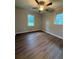 Bedroom with hardwood floors and window allowing natural light at 882 Campbell Rd, Covington, GA 30014