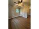Bedroom featuring hardwood floors, natural light, and closet at 882 Campbell Rd, Covington, GA 30014