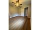 Bedroom featuring wood-look flooring and ceiling fan with light at 882 Campbell Rd, Covington, GA 30014