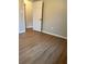 Bedroom with laminate flooring and white painted door at 882 Campbell Rd, Covington, GA 30014