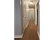 Bright hallway featuring hardwood floors and access to multiple rooms at 882 Campbell Rd, Covington, GA 30014