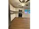 A modern kitchen featuring stainless steel appliances, white cabinets and durable floors at 882 Campbell Rd, Covington, GA 30014