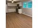 A modern kitchen featuring stainless steel appliances, white cabinets and durable floors at 882 Campbell Rd, Covington, GA 30014