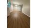 Cozy living room featuring hardwood floors, natural light, and a view into the dining room at 882 Campbell Rd, Covington, GA 30014