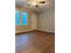 Cozy living room featuring beautiful hardwood floors, natural light, and a front door at 882 Campbell Rd, Covington, GA 30014