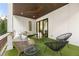 Cozy balcony with modern furniture, green turf, and a sleek ceiling fan, perfect for outdoor relaxation at 1102 Sanders Se Ave, Atlanta, GA 30316