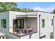 The covered balcony features comfortable seating, and stylish wood railing at 1102 Sanders Se Ave, Atlanta, GA 30316