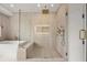 Luxurious bathroom features a glass-enclosed shower, soaking tub, and modern fixtures at 1102 Sanders Se Ave, Atlanta, GA 30316