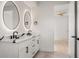 Bathroom boasts double sinks, quartz counters, modern fixtures, and illuminated mirrors at 1102 Sanders Se Ave, Atlanta, GA 30316