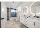 Well-lit bathroom featuring double vanity, bath tub shower combo and built in shelves at 1102 Sanders Se Ave, Atlanta, GA 30316