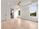 Bright bedroom features hardwood floors, fan, white walls, and two large windows for natural light at 1102 Sanders Se Ave, Atlanta, GA 30316