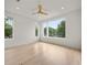 Bright bedroom with hardwood floors, recessed lighting and multiple large windows with wooded views at 1102 Sanders Se Ave, Atlanta, GA 30316