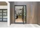 Open front door reveals a contemporary interior with hardwood floors, modern staircase, and inviting decor at 1102 Sanders Se Ave, Atlanta, GA 30316