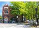 Outdoor seating at Flatiron restaurant on a tree-lined street at 1102 Sanders Se Ave, Atlanta, GA 30316