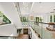 Bright, modern foyer with wood door, floating staircase, and an elegant chandelier at 1102 Sanders Se Ave, Atlanta, GA 30316