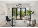 Bright home office featuring glass desk, modern decor, and view to front yard at 1102 Sanders Se Ave, Atlanta, GA 30316