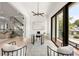 Home office featuring glass desk, modern decor, and view to outdoor deck at 1102 Sanders Se Ave, Atlanta, GA 30316
