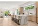 Open kitchen featuring marble waterfall island with bar seating and modern appliances at 1102 Sanders Se Ave, Atlanta, GA 30316