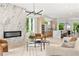 Open concept living room with fireplace, modern furniture, and seamless transition to the kitchen at 1102 Sanders Se Ave, Atlanta, GA 30316