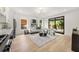 Stylish open-concept living room with hardwood floors, backyard access, and neutral decor at 1102 Sanders Se Ave, Atlanta, GA 30316