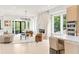 Open-concept living area with marble fireplace, modern furnishings, and view to back yard at 1102 Sanders Se Ave, Atlanta, GA 30316