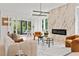 Cozy living room featuring a marble fireplace, modern furniture, and sliding door access to the outside at 1102 Sanders Se Ave, Atlanta, GA 30316