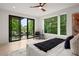Cozy main bedroom with balcony access, large windows, and a ceiling fan, creating a relaxing retreat at 1102 Sanders Se Ave, Atlanta, GA 30316