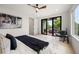 Cozy main bedroom with balcony access, natural light, and stylish décor, perfect for relaxation at 1102 Sanders Se Ave, Atlanta, GA 30316