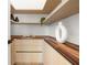 Walk in pantry with custom wood shelves, cabinets, and countertop at 1102 Sanders Se Ave, Atlanta, GA 30316