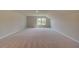 Large bonus room with neutral walls and carpeted floors at 568 Teversham Dr, Mcdonough, GA 30253