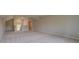 Spacious bonus room with neutral walls and carpeted floors at 568 Teversham Dr, Mcdonough, GA 30253