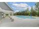 Relax by the community pool under the covered patio, with beautiful views of the lush landscaping at 568 Teversham Dr, Mcdonough, GA 30253