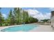 Enjoy a relaxing swim in the community pool with views of the surrounding green landscape at 568 Teversham Dr, Mcdonough, GA 30253