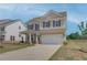 Well-maintained two-story home with an attached two-car garage and green lawn at 568 Teversham Dr, Mcdonough, GA 30253
