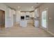 Modern kitchen with white cabinets, stainless steel appliances, and an island for food prep at 568 Teversham Dr, Mcdonough, GA 30253