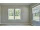 Bright living room with light-colored walls, hardwood floors, and natural light at 568 Teversham Dr, Mcdonough, GA 30253