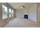 Light-filled living room with hardwood floors, fireplace, and lots of natural light at 568 Teversham Dr, Mcdonough, GA 30253