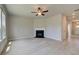 Spacious living room featuring a fireplace, light hardwood floors, and neutral walls at 568 Teversham Dr, Mcdonough, GA 30253
