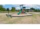 Community playground with slides and climbing structures, surrounded by green space at 568 Teversham Dr, Mcdonough, GA 30253