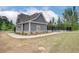 Charming pool house features gray siding, a well-manicured landscape, and easy access to the community pool at 568 Teversham Dr, Mcdonough, GA 30253