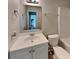 This bathroom features a single sink vanity, mirror, toilet, and shower/tub at 1236 Pinedale Nw Cir, Conyers, GA 30012